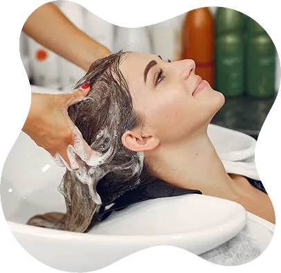 woman washing head hair salon